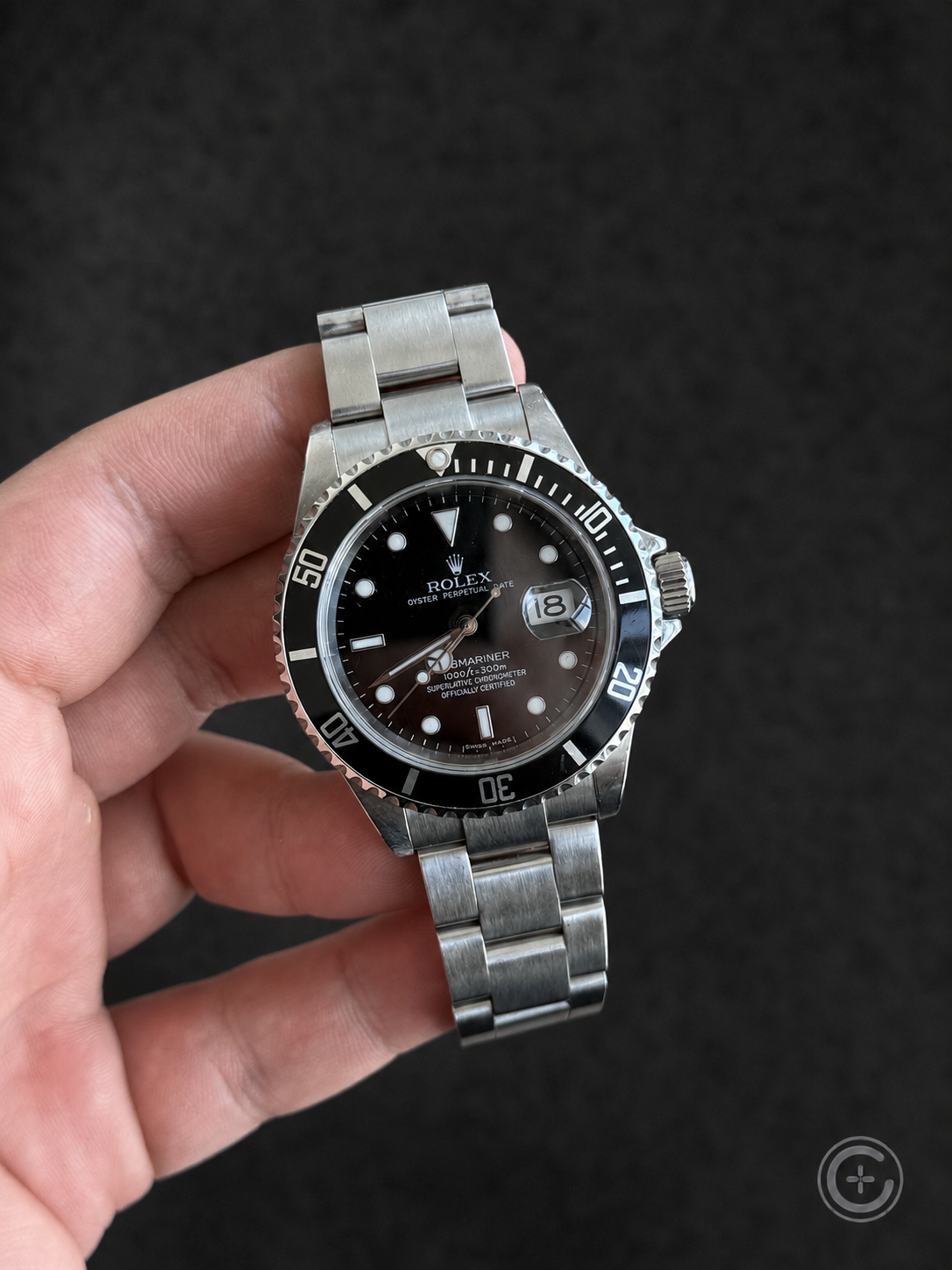 Vintage Rolex Submariner Date reference 16610 with black dial and bezel