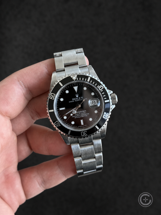 Vintage Rolex Submariner Date reference 16610 with black dial and bezel